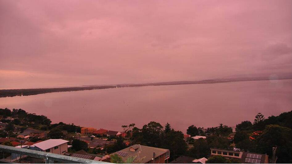Pink sky reflected on Lake Illawarra on Christmas morning. Courtesy Bill Lyn Janssen