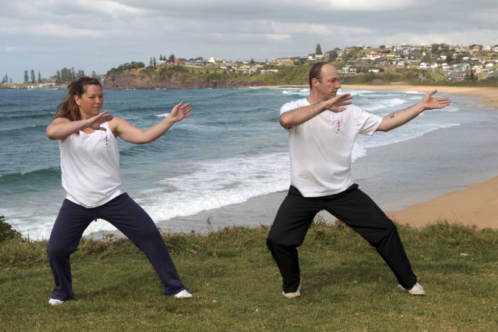 Halinka Orszulok and Alan Baxter from Illawarra Kung Fu Academy show some tai chi moves. Picture: GREG TOTMAN