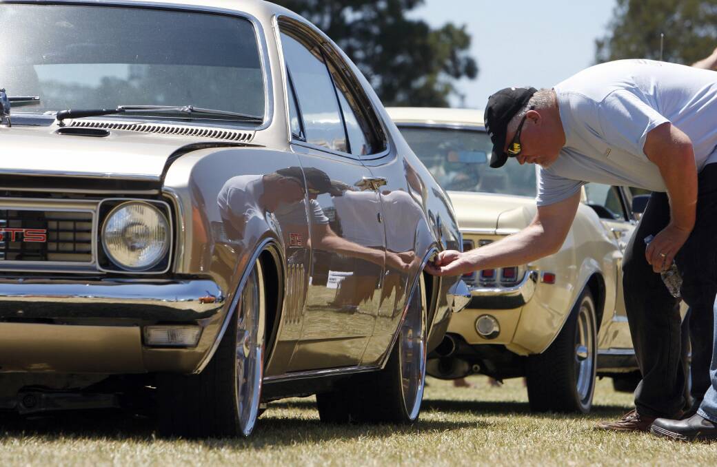 A man checks out the workmanship on a Holden HT Monaro at the Autorama Car and Bike Expo. Picture: ANDY ZAKELI