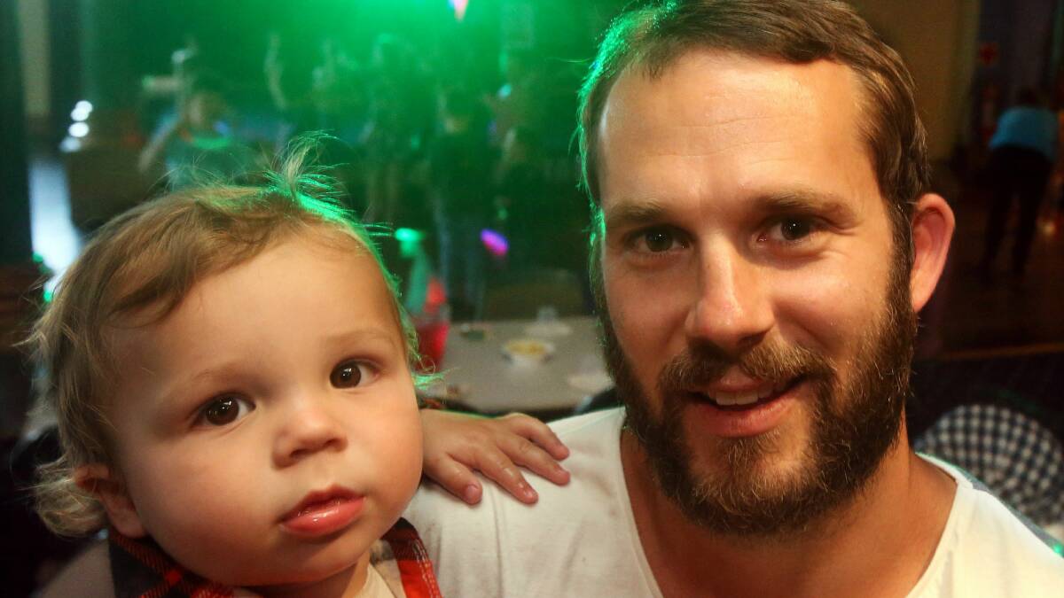 Gujarat worker Beau Franklin and son Ryder join the party at the Fraternity Club last night. Picture: ROBERT PEET