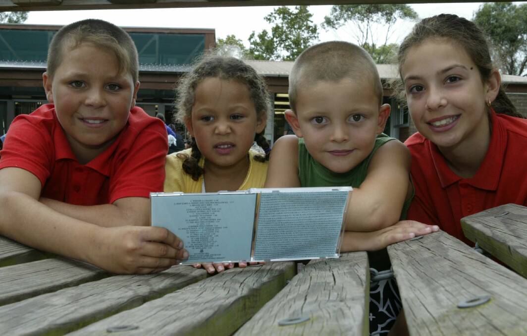 Kemblawarra school students Darren, Talia, Jack and Shantel with their school’s latest CD.