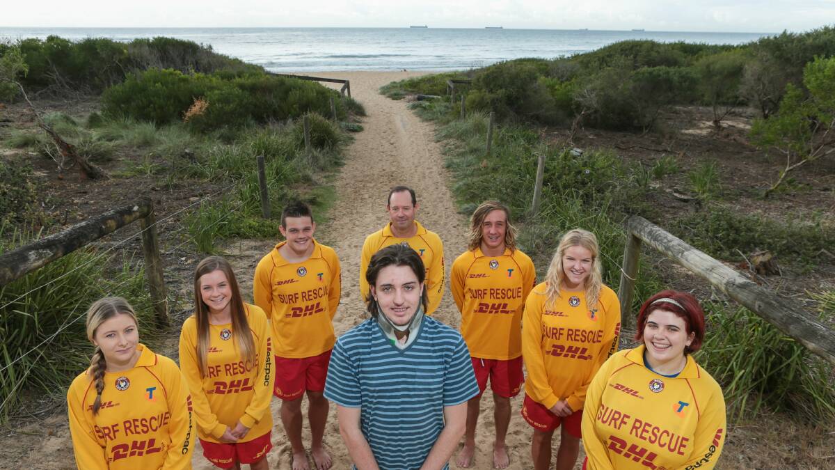 Woonona teen Lewis McLeod with the Woonona SLSC lifesavers who assisted in his rescue. Picture: ADAM McLEAN