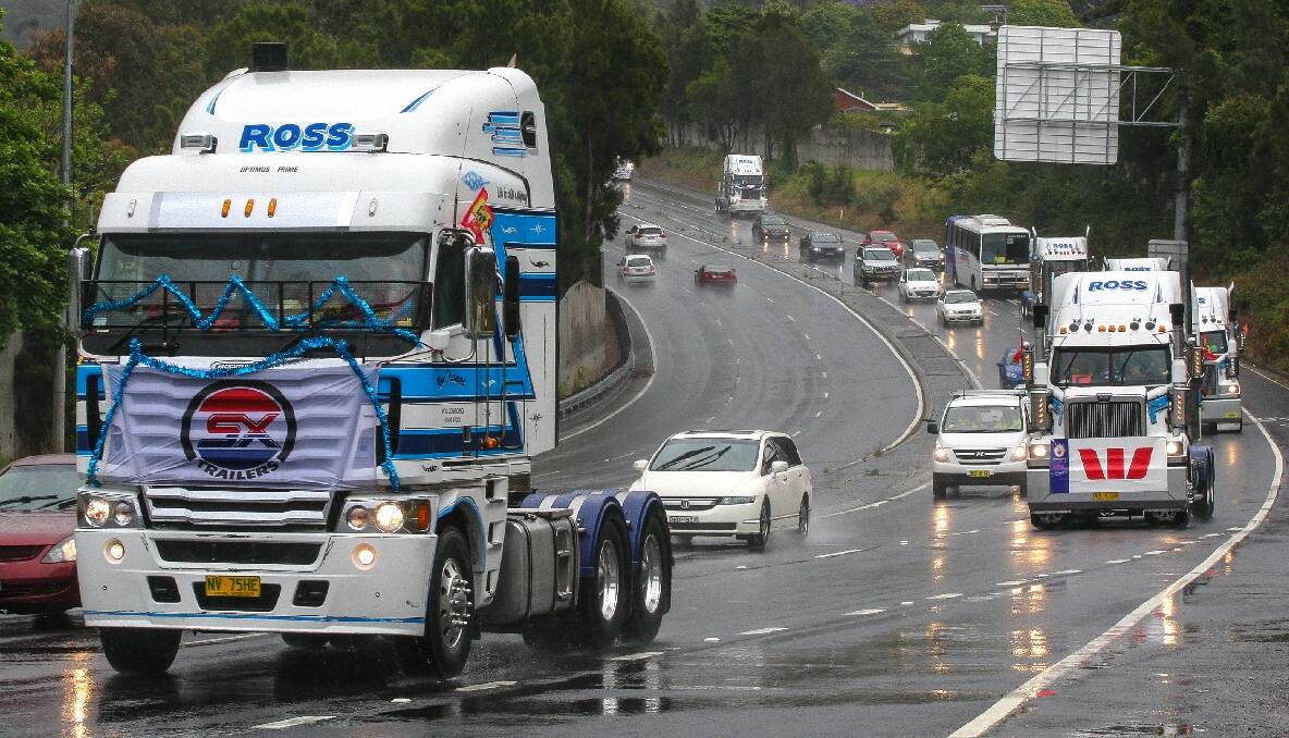 Trucks on Mt Ousley Road for the 2013 i98FM Camp Quality Convoy for Kids. Picture: ADAM McLEAN