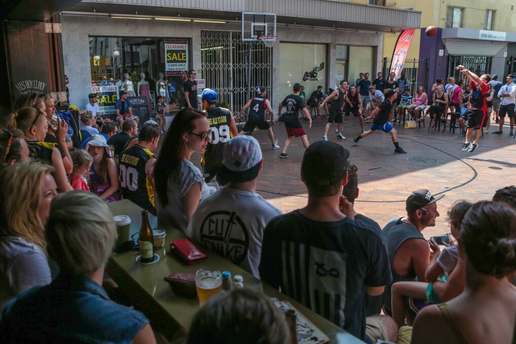 Cafe workers compete with each other during the Globe Lane cafe basketball tournament. Picture: ADAM McLEAN
