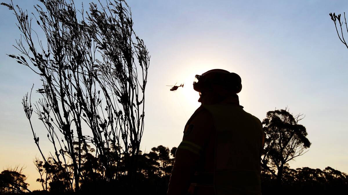Firefighters work to control the bushfire near Jamberoo. Picture: SYLVIA LIBER