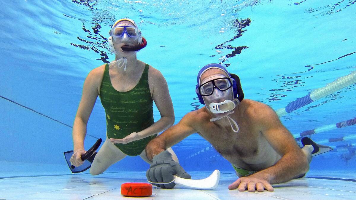 University Underwater Hockey Club players Eden Brown and Phil Ackerman in August. Picture: KIRK GILMOUR