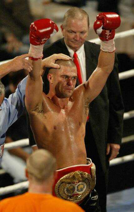 Shannan Taylor salutes the audience after his TKO against Ian McLeod.