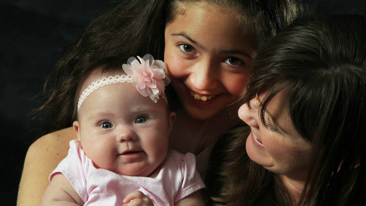 Wave FM breakfast host Jade Papesch with daughters Alani, 11, and Lulu, four months. Picture: ANDY ZAKELI