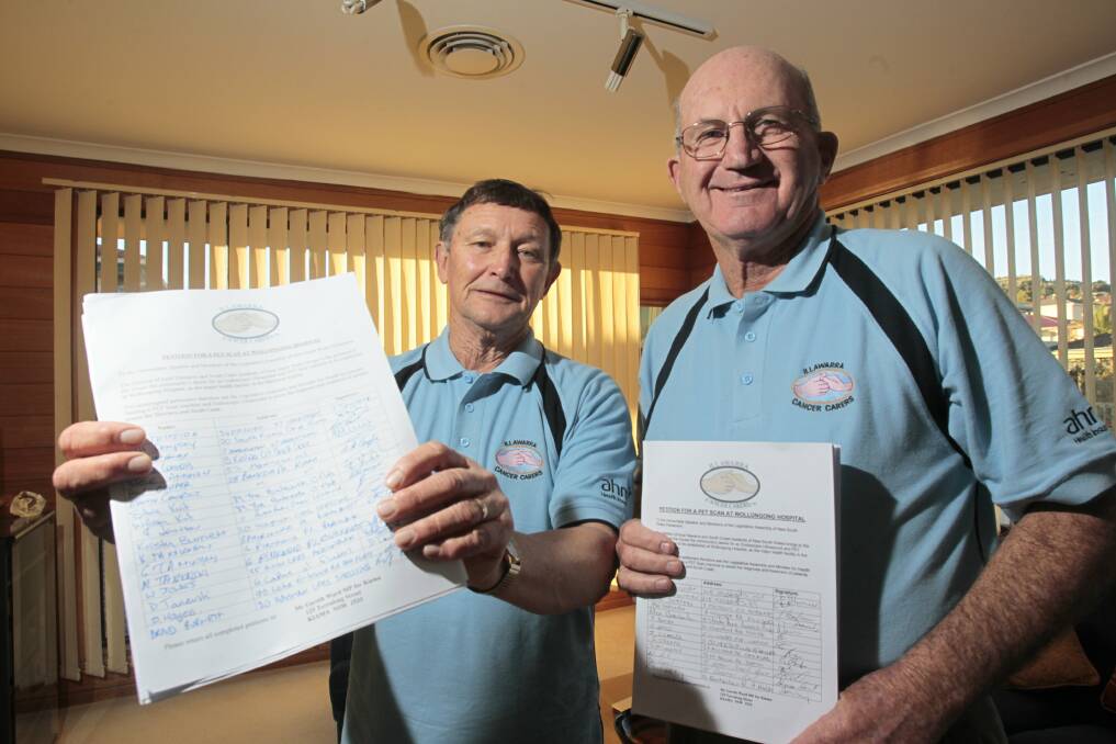 Barrie Weston and Keith Wilson of Illawarra Cancer Carers with the petition in June.