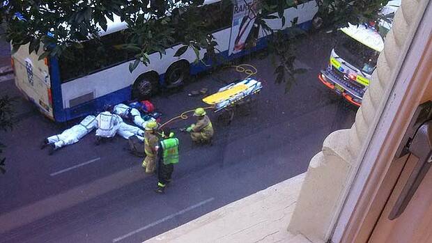 Paramedics treat the woman. Photo: Keiran O'Shea, Fairfax reader
