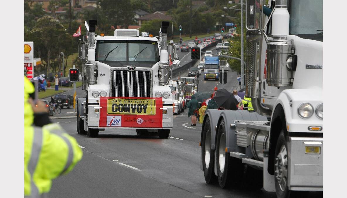 Trucks on Lake Entrance Road for the 2013 i98FM Camp Quality Convoy for Kids. Picture: ANDY ZAKELI
