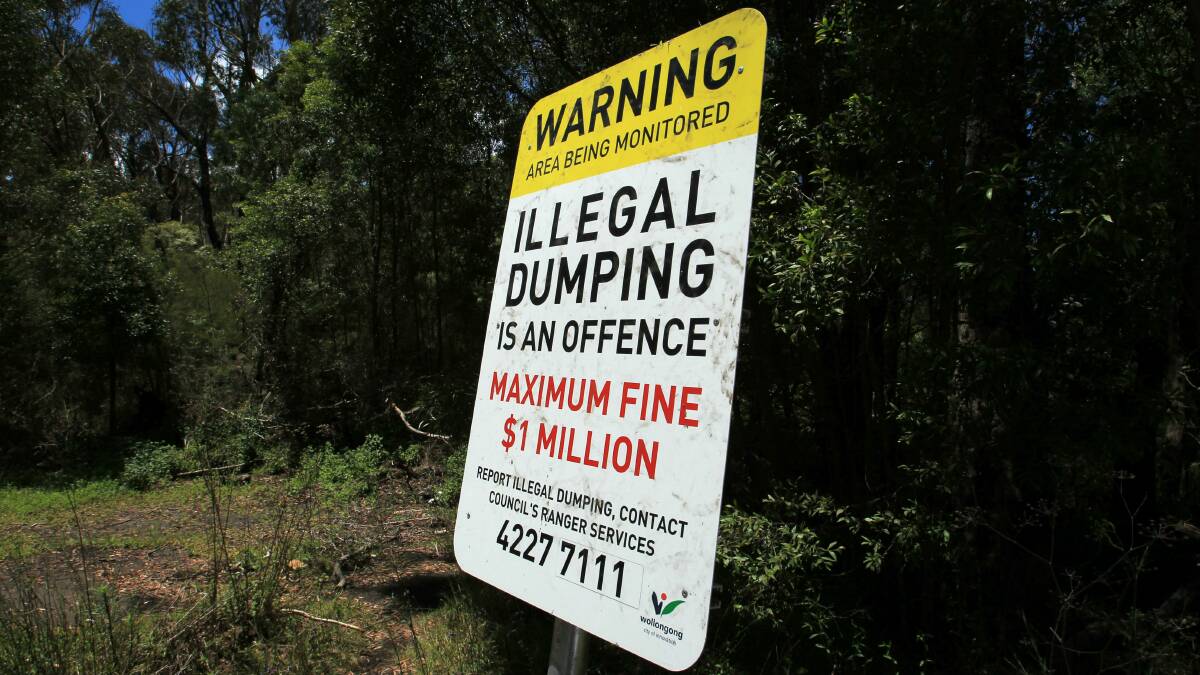 Signs make clear the penalties for illegal dumping of rubbish. Picture: ORLANDO CHIODO