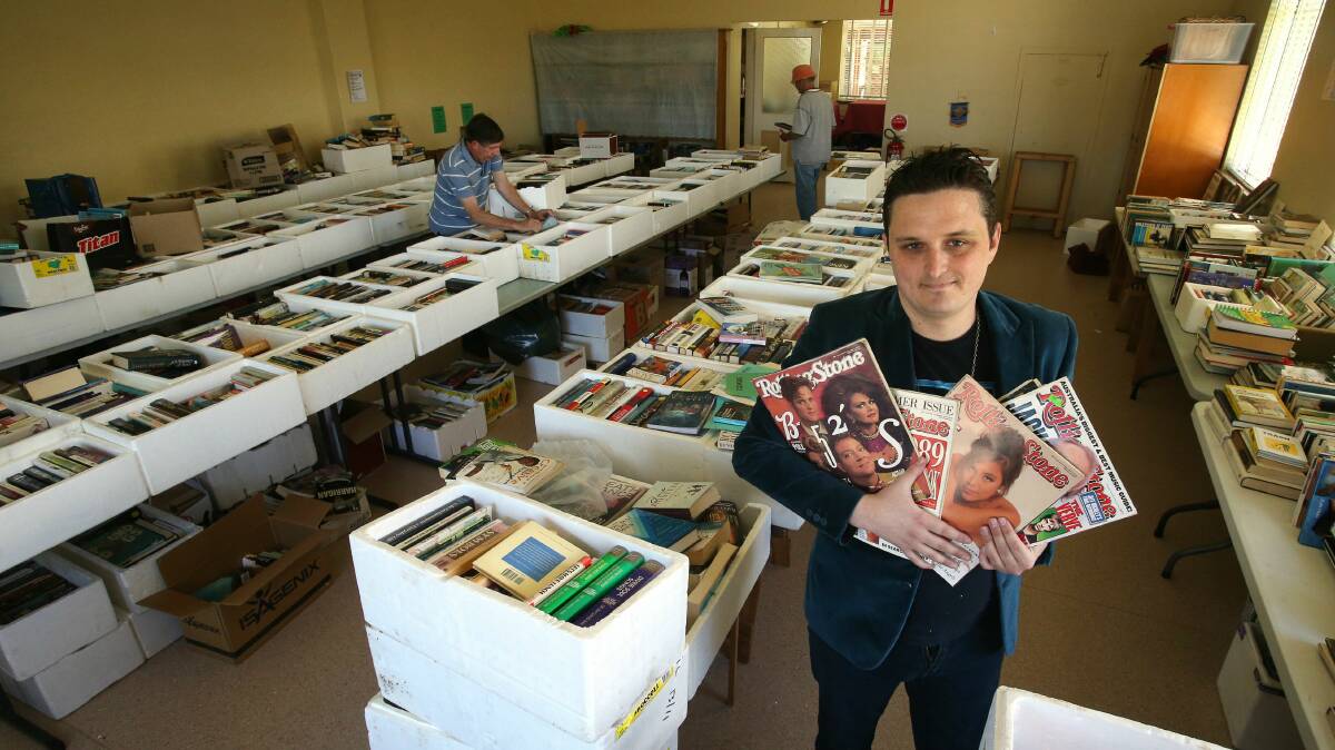Mitchell Gordon with mint copies of Rolling Stone magazine that will be auctioned at the book fair. Picture: KIRK GILMOUR