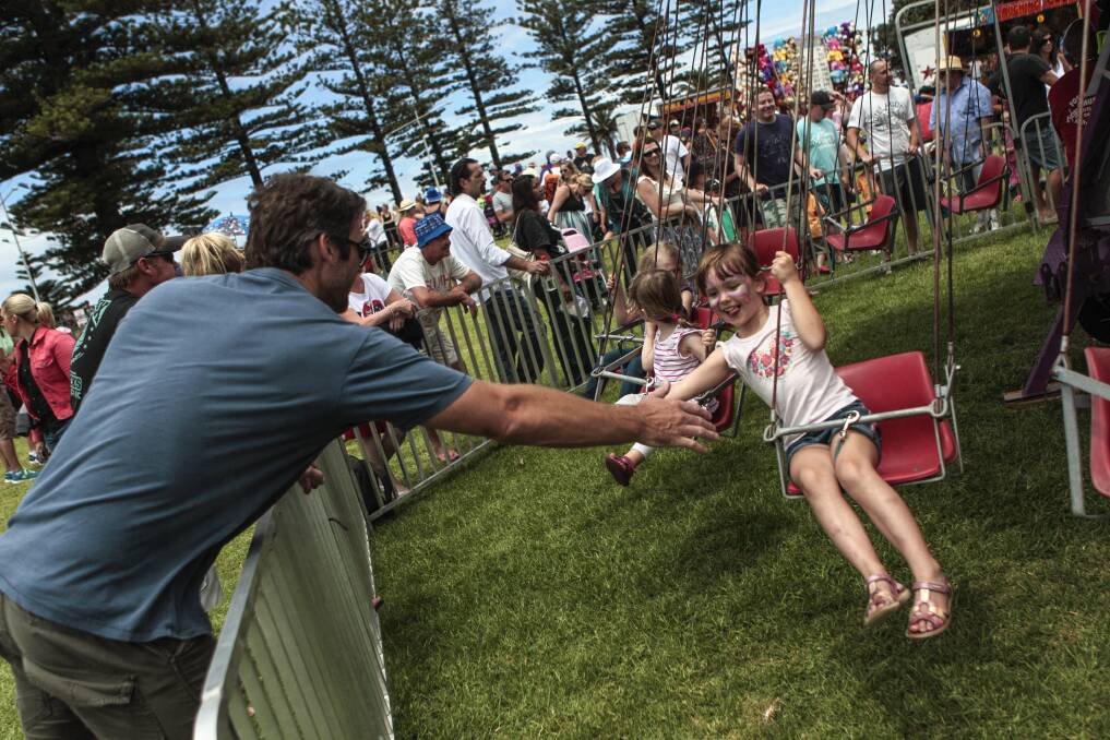 Maya high-fives her dad at Belmore Basin. Picture: CHRISTOPHER CHAN