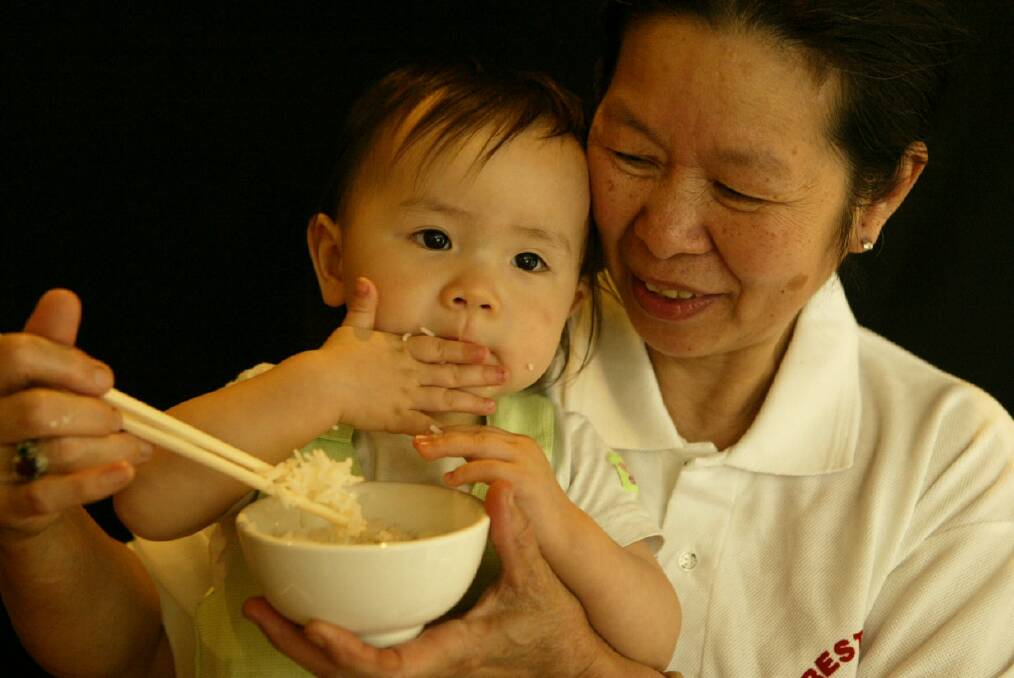 Lien Dao, 65, with family friend Vivien Hoang, 15 months, at Trangs Vietnamese Restaurant in Keira Street.