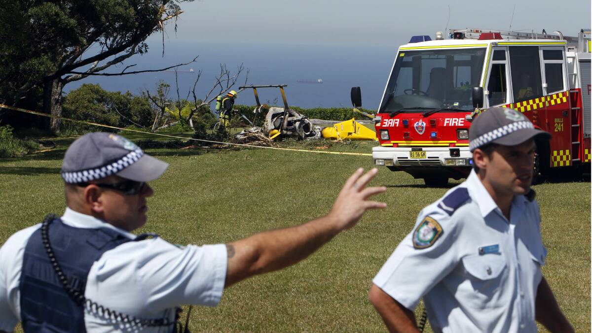 Police manage the scene of the helicopter crash. Picture: ANDY ZAKELI