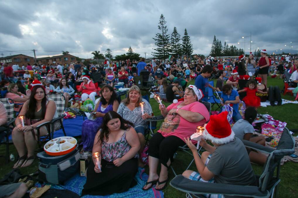 Carollers get into the Christmas spirit at Reddall Reserve. Picture: ADAM McLEAN