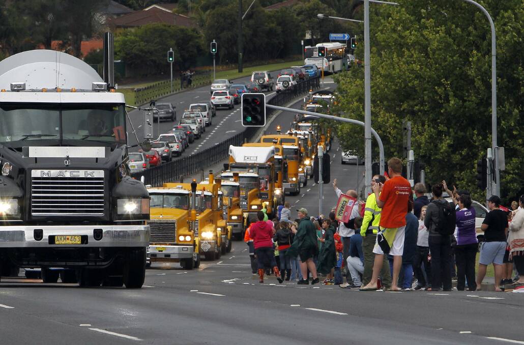  Crowds gather along Lake Entrance Road for the 2013 i98FM Camp Quality Convoy for Kids. Picture: ANDY ZAKELI