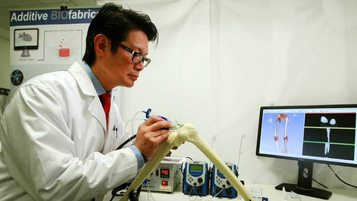 Professor Peter Choong demonstrates the BioPen prototype. Picture: SYLVIA LIBER