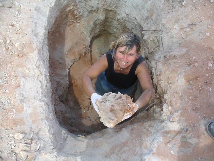 Curator of geography at UOW, Penny Williamson, at Woolcunda Station near Broken Hill digging for gypsum.
