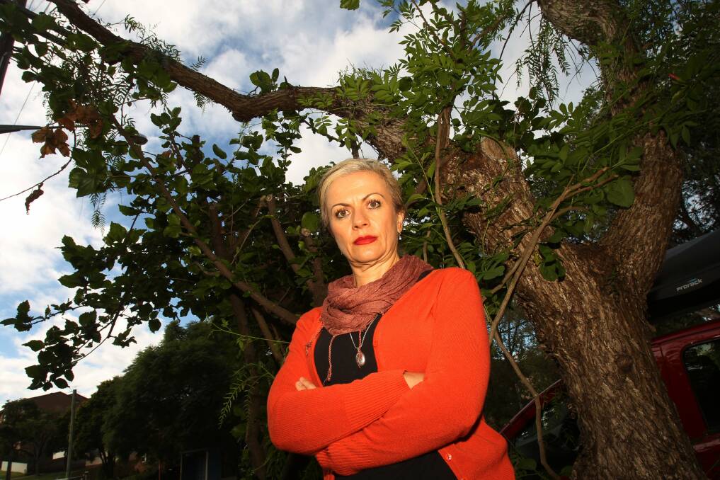 Boz Urukalo is angry at how severely Endeavour Energy cut her trees. Picture: GREG TOTMAN
