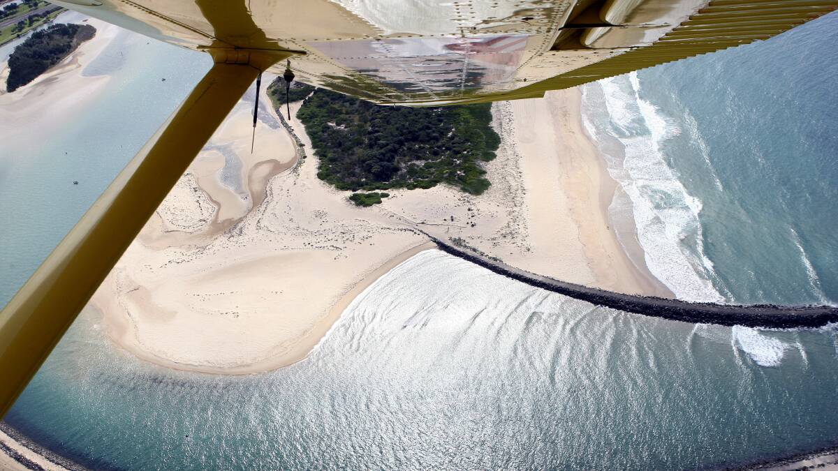 An aerial patrol plane over Lake Illawarra.