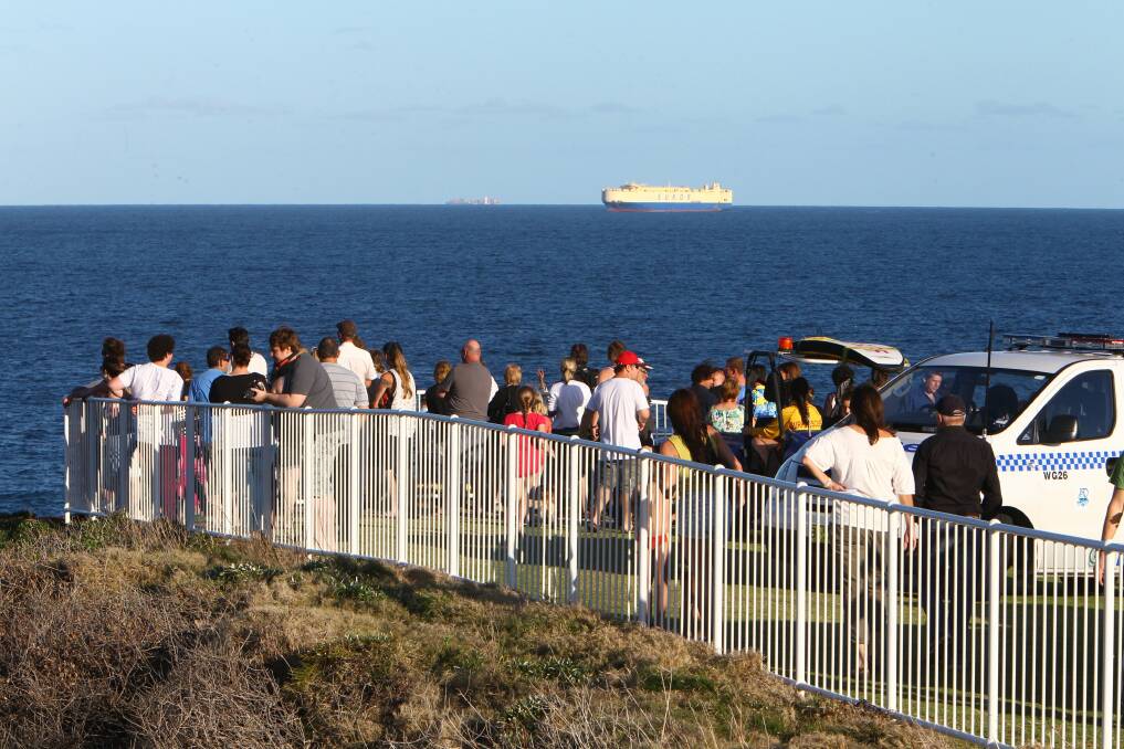 Emergency service personnel scan the sea at Flagstaff Hill. Pictures: KEN ROBERTSON