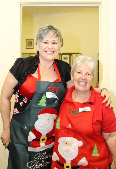 Julie Price and Robyn Baxter at the DENNY Foundation's Christmas Day lunch. Picture: GREG ELLIS