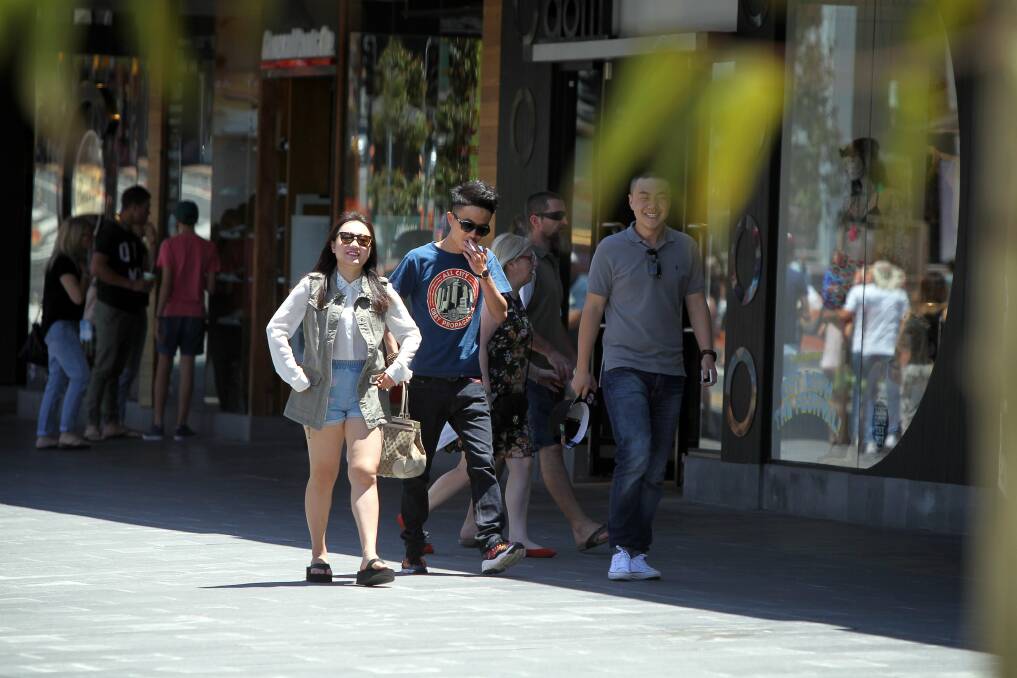 Smokers in the Crown Street Mall face a talking to for breaching the ban. Picture: SYLVIA LIBER