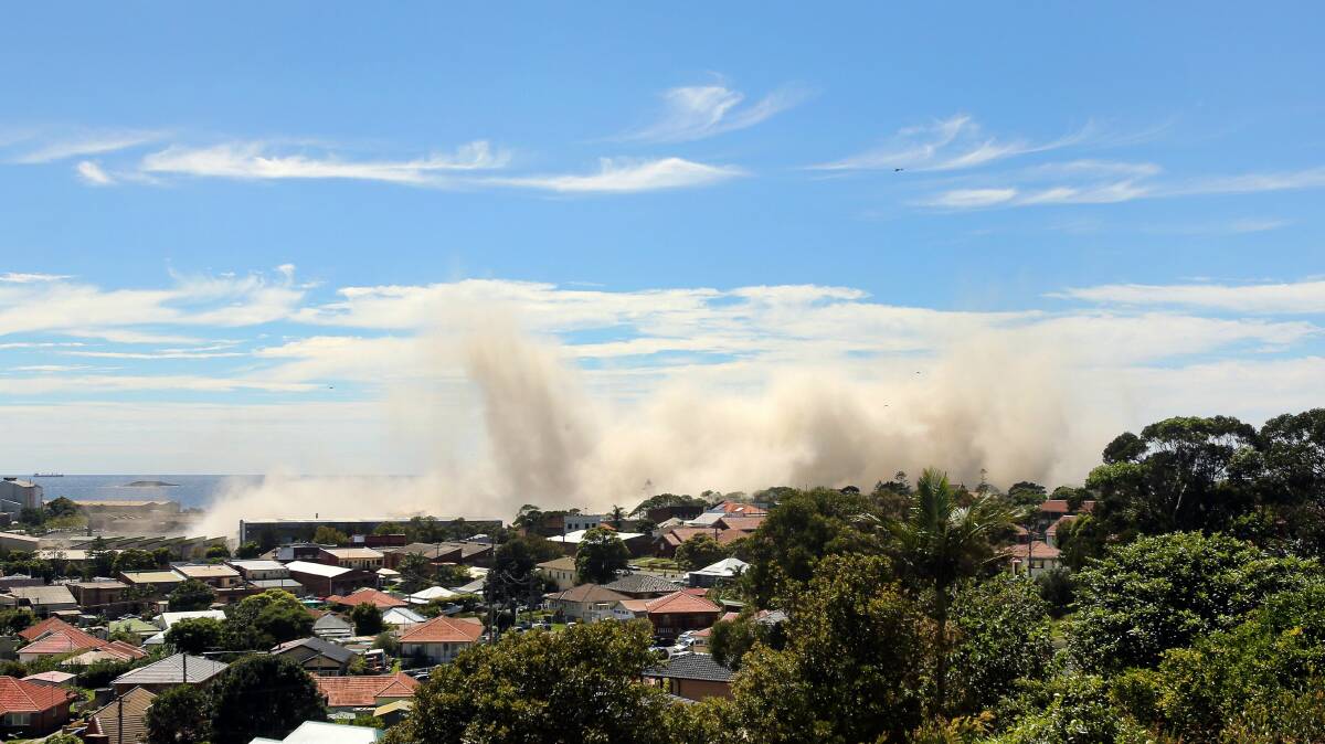 A plume rises following the Port Kembla Stack downing on Thursday. Pictures: KIRK GILMOUR