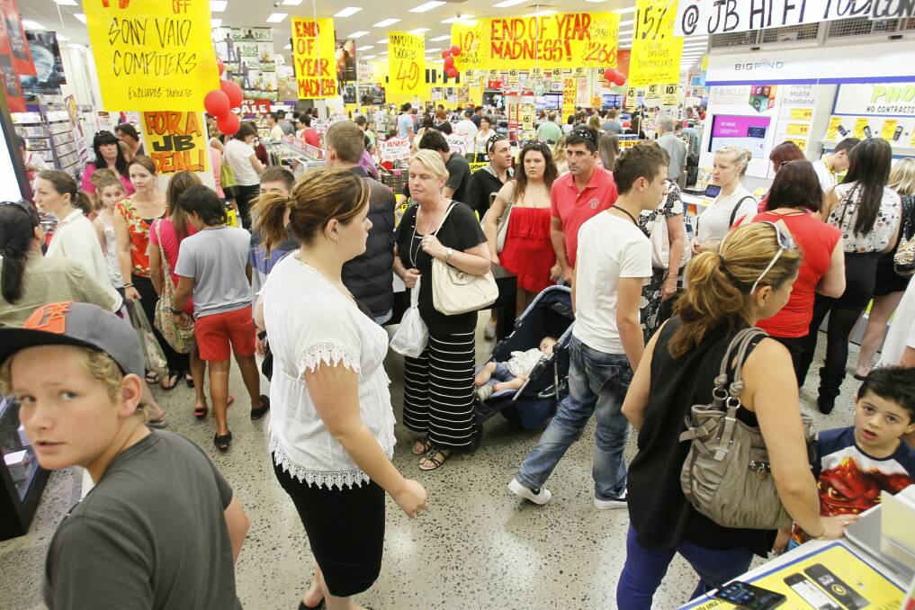  Shoppers hunt for a Boxing Day sale bargain at JB Hi-Fi’s Stockland Shellharbour store yesterday. 