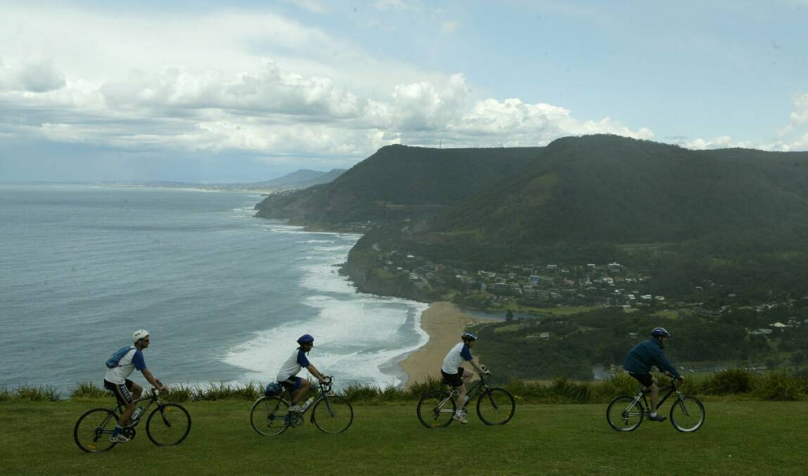 Members of the Voodoo Blue Skydiving team take in the views of the Illawarra escarpment from Bald Hill, Stanwell Park.