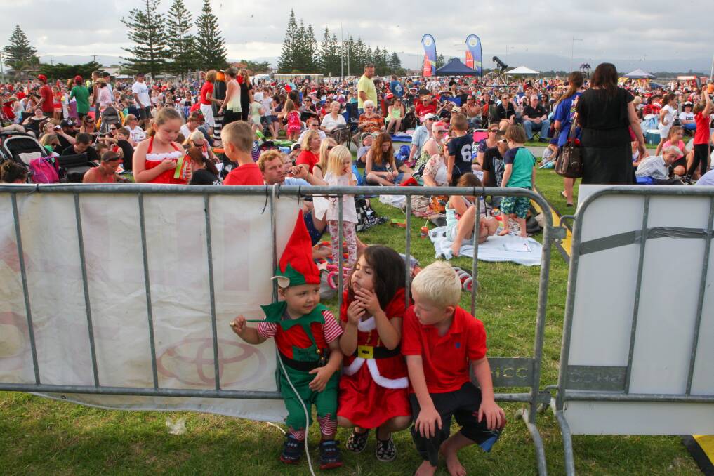 Carollers get into the Christmas spirit at Reddall Reserve. Picture: ADAM McLEAN
