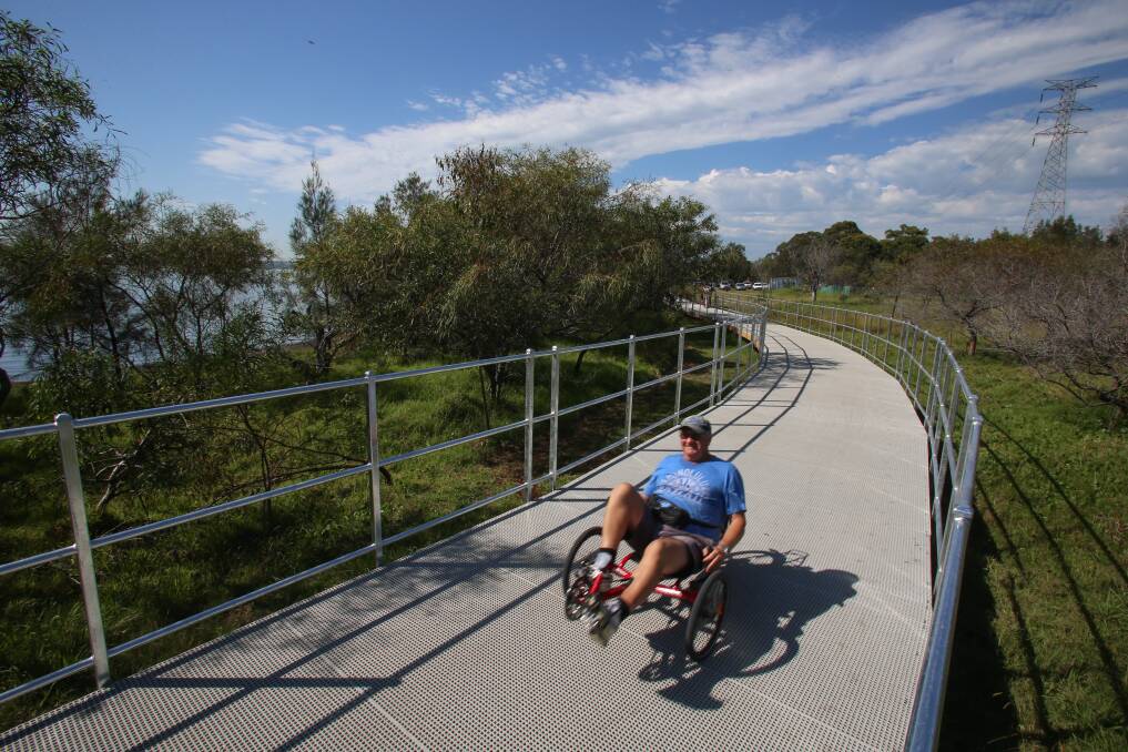 Terry Shaw, of Koonawarra, tests out the new boardwalk at Tallawarra on his recumbent bike yesterday. Picture: ADAM McLEAN