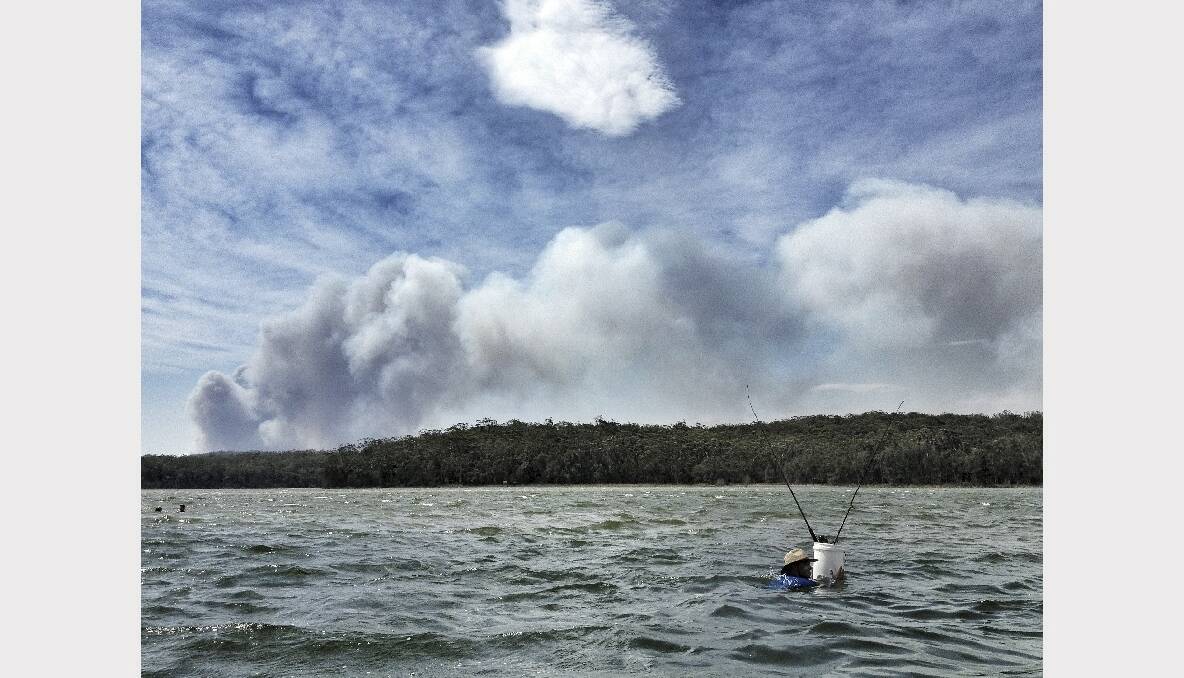 The view from Lake Conjola looking south to the Wandandian fire. Picture: DYLAN ROBINSON 