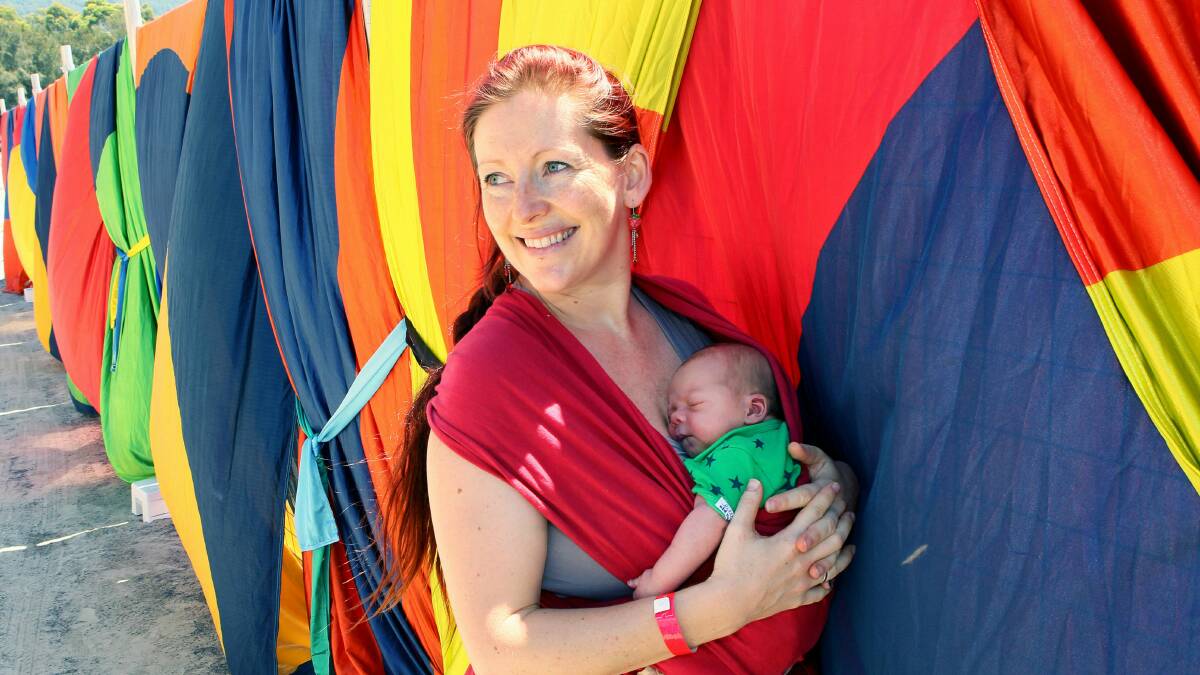 Shane Moon with her two-day-old baby girl, Harriet, the youngest festival-goer. Picture: KIRK GILMOUR
