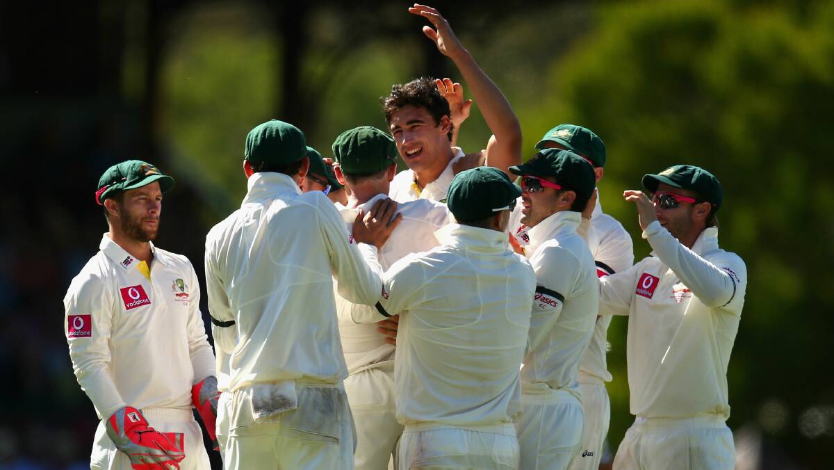 Mitchell Starc and teammates celebrate the wicket of Angelo Mathews. Picture: GETTY IMAGES