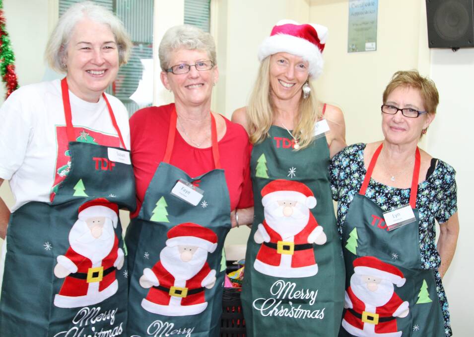 Susan Garrett, Faye Biggs, Cheryl James and Lyn Young at the DENNY Foundation's Christmas Day lunch. Picture: GREG ELLIS