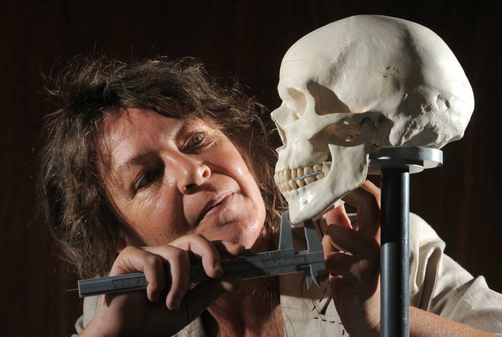 Dr Susan Hayes with the replica skull she uses to teach facial anthropology. Pictures: GRAHAM TIDY