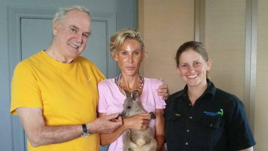 Shoalhaven Zoo senior keeper Jeni Brown with John Cleese and his wife Jennifer Wade and eight-month-old joey Honey.
