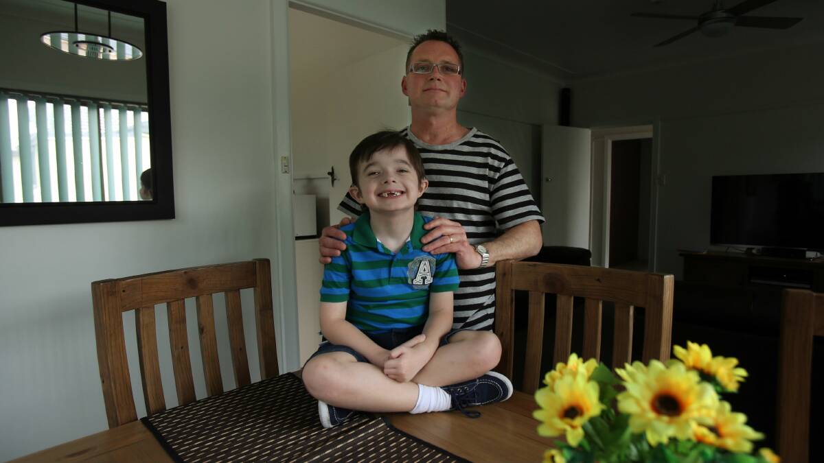 Isaac Davis, with his father Mark, stayed home at the end of last week. Picture: ROBERT PEET