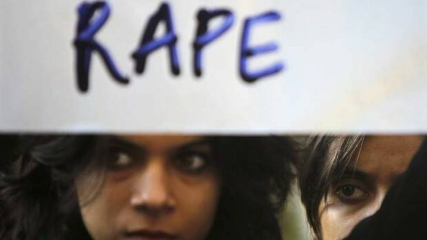A protester at a rally demanding the state government to ensure the safety of women. Picture: Reuters