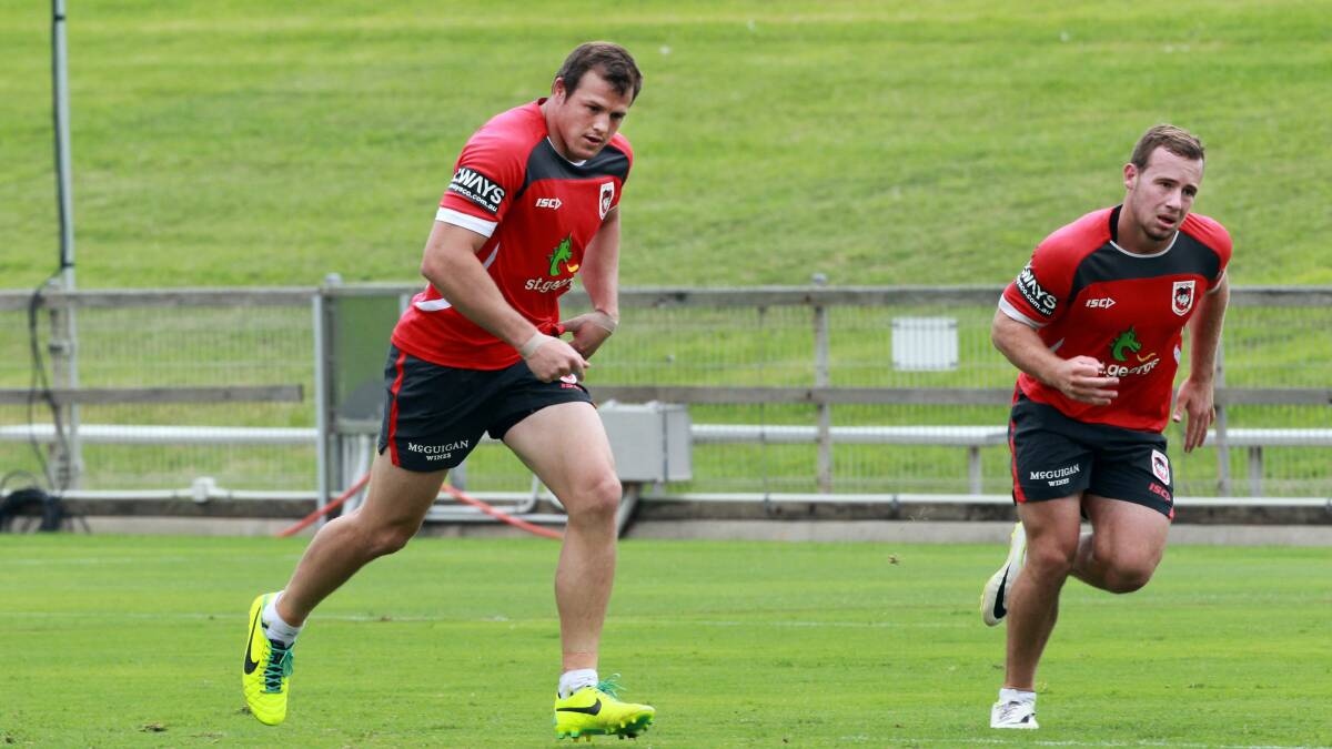 Brett Morris and Adam Quinlan put in the hard yards at Dragons training on Thursday.  Picture: ORLANDO CHIODO