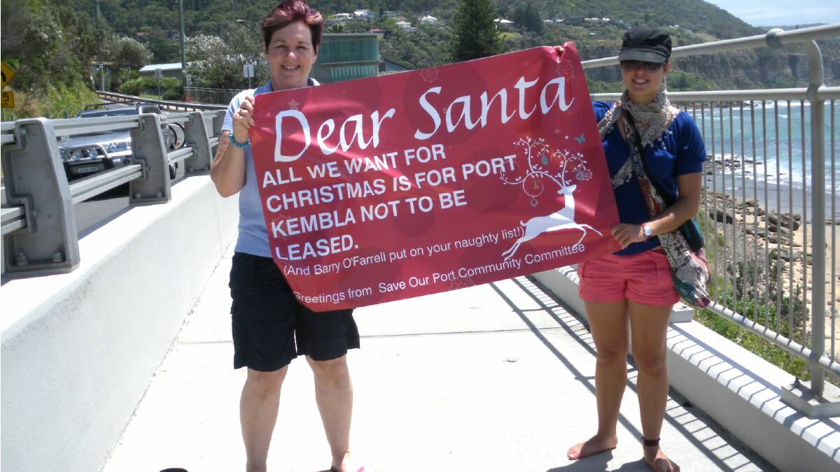 Illawarra residents with the Dear Santa sign.