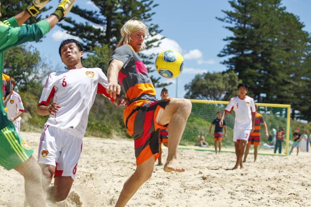 China plays Wollongong in a beach soccer friendly at North Beach. Picture: CHRISTOPHER CHAN