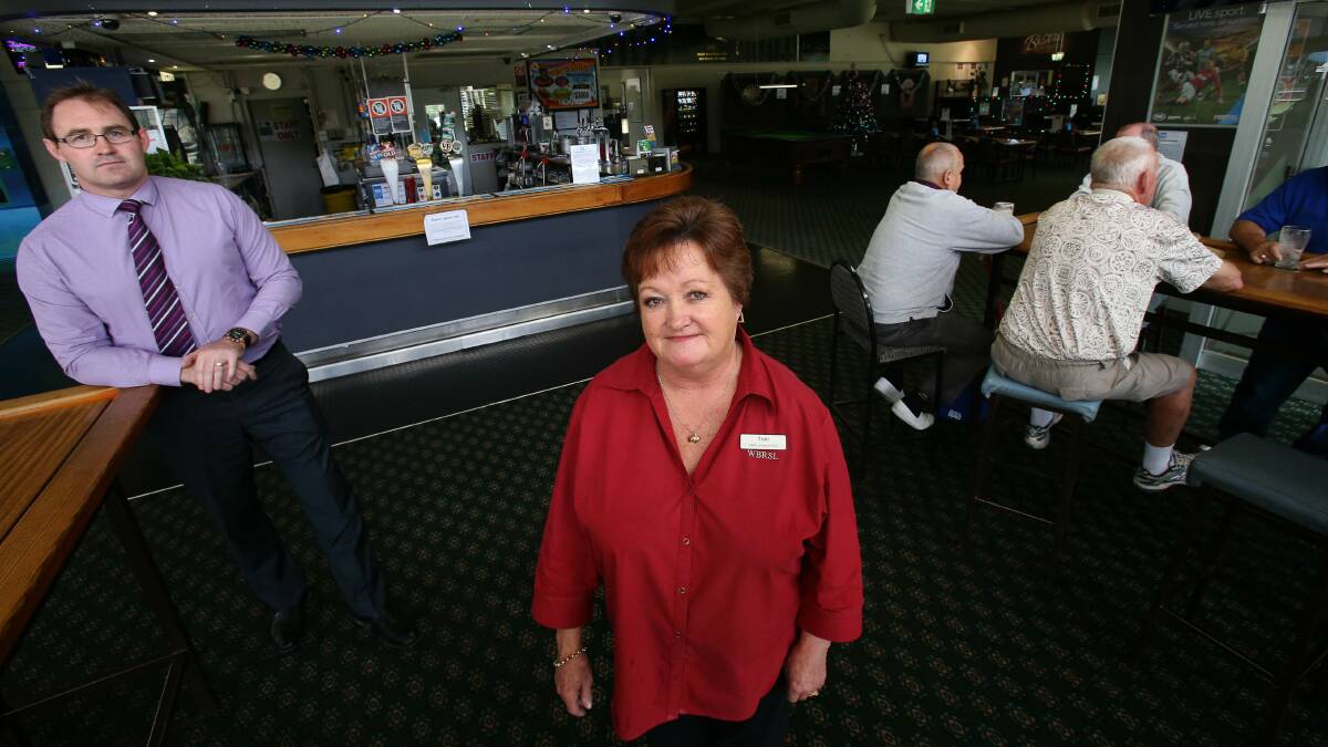 Woonona Bulli RSL Club manager Michael Brennan, with barmaid Toni Newell. Picture: KIRK GILMOUR