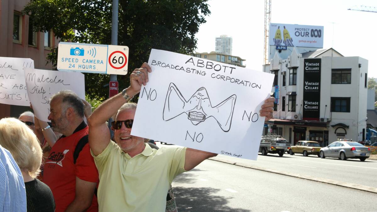 Protesters in front of an ABC billboard in Rushcutters Bay on Thursday. Picture: EDWINA PICKLES