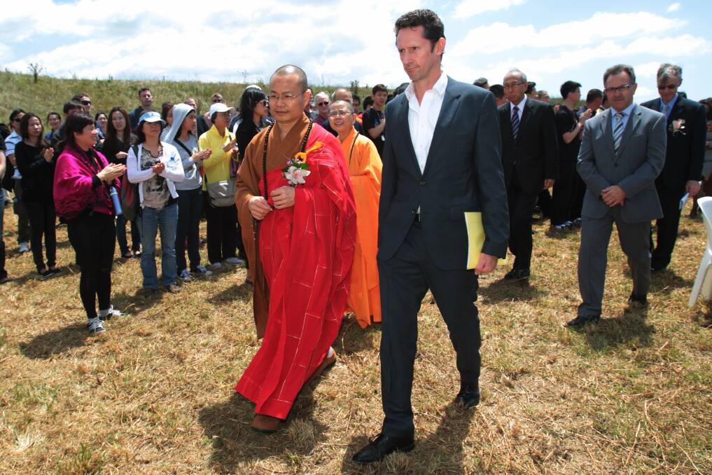 Abbot of Fo Guang Shan, Taiwan Venerable Hsin Pei walks with Throsby MP Stephen Jones. Pictures: GREG TOTMAN