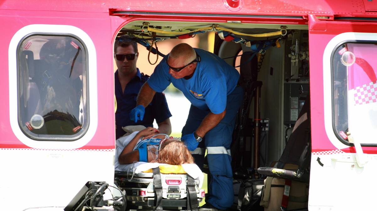 A woman is airlifted to St George Hospital after falling from a wall at Port Kembla Olympic Pool on Sunday.