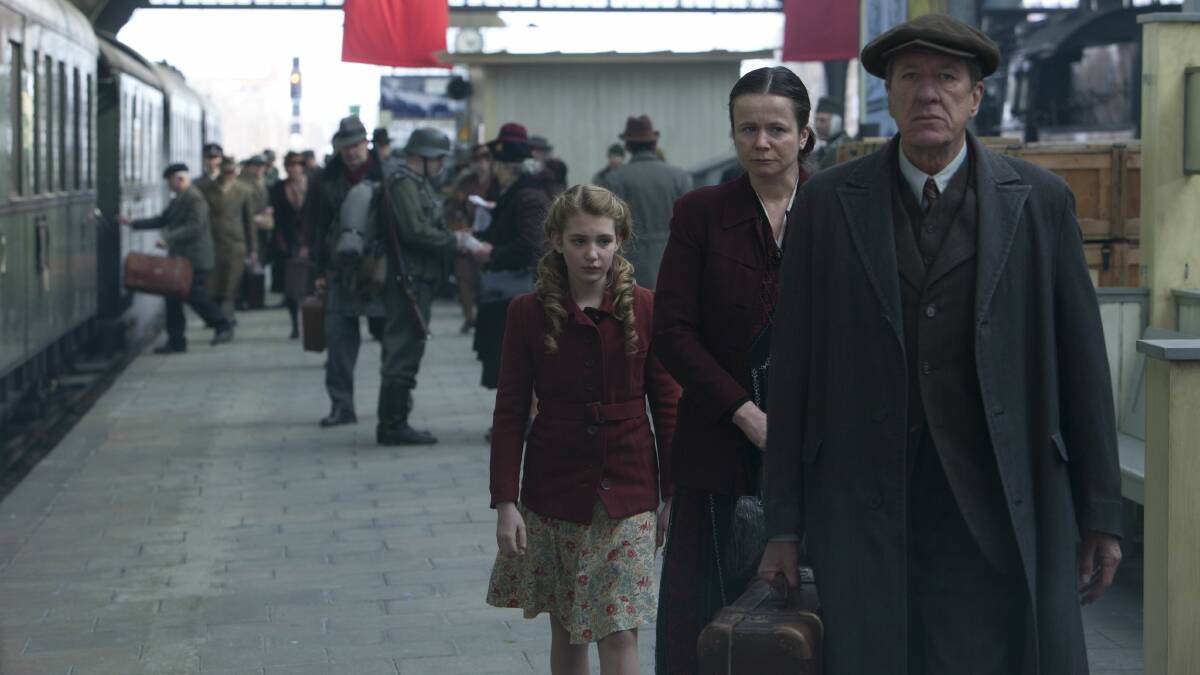 Geoffrey Rush with co-stars Emily Watson and Sophie Nelisse in the Book Thief.